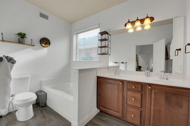 832 Lake Worth Trl, Little Elm, TX 75068 - full bathroom featuring a garden tub, double vanity, and toilet