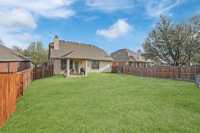 832 Lake Worth Trl, Little Elm, TX 75068 - rear view of house with a chimney and a patio