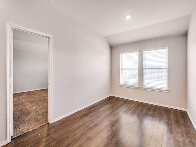 410 Wrangler Dr, Josephine, TX 75189 - empty room with dark wood-style floors, baseboards, and vaulted ceiling