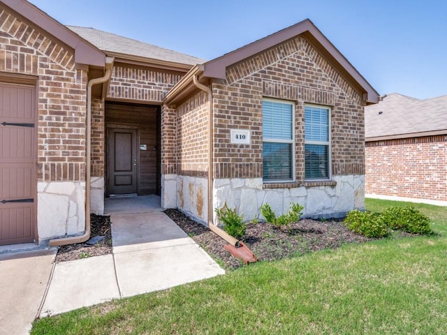 410 Wrangler Dr, Josephine, TX 75189 - doorway to property featuring brick siding, a lawn, and stone siding