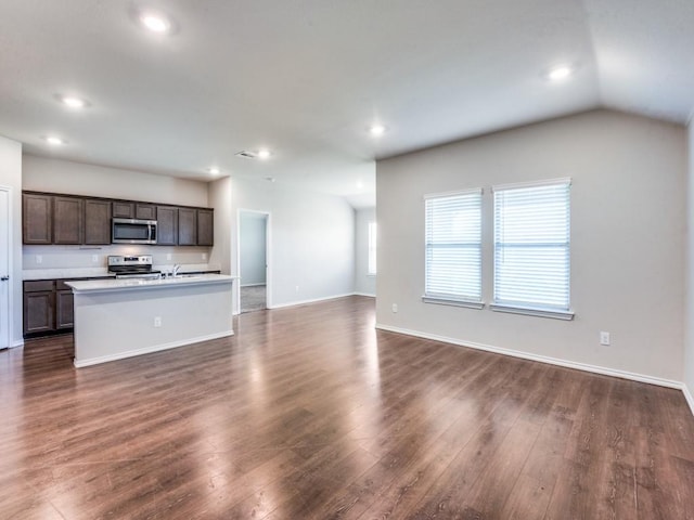 410 Wrangler Dr, Josephine, TX 75189 - kitchen featuring appliances with stainless steel finishes, open floor plan, dark wood finished floors, an island with sink, and recessed lighting