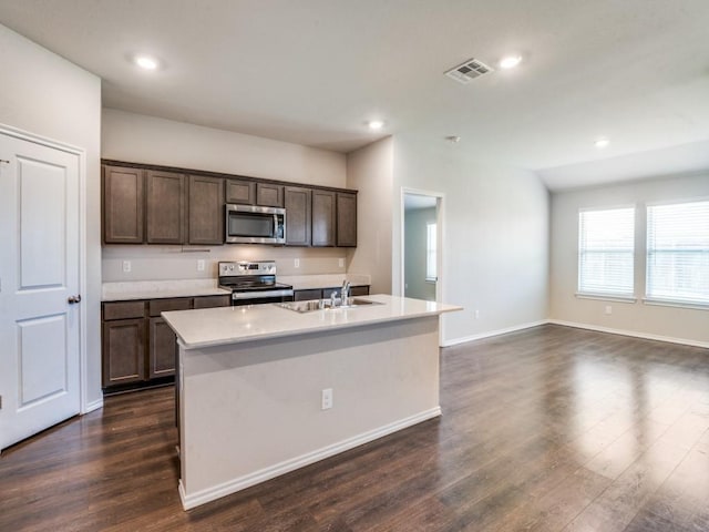 410 Wrangler Dr, Josephine, TX 75189 - kitchen with appliances with stainless steel finishes, a sink, dark wood finished floors, recessed lighting, and dark brown cabinets