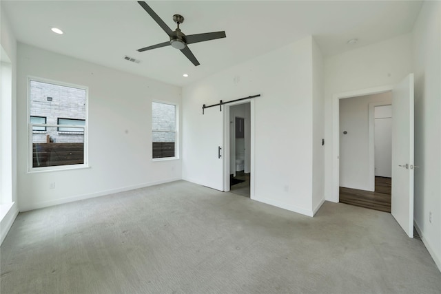 8356 Fairview Dr, Frisco, TX 75033 - unfurnished bedroom with carpet flooring, a barn door, recessed lighting, baseboards, and a ceiling fan