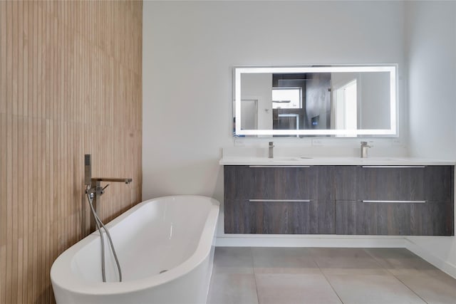 8356 Fairview Dr, Frisco, TX 75033 - bathroom featuring double vanity, a soaking tub, and tile patterned floors