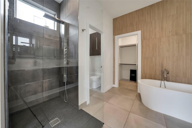 8356 Fairview Dr, Frisco, TX 75033 - bathroom with a shower stall, a freestanding tub, toilet, tile patterned floors, and baseboards