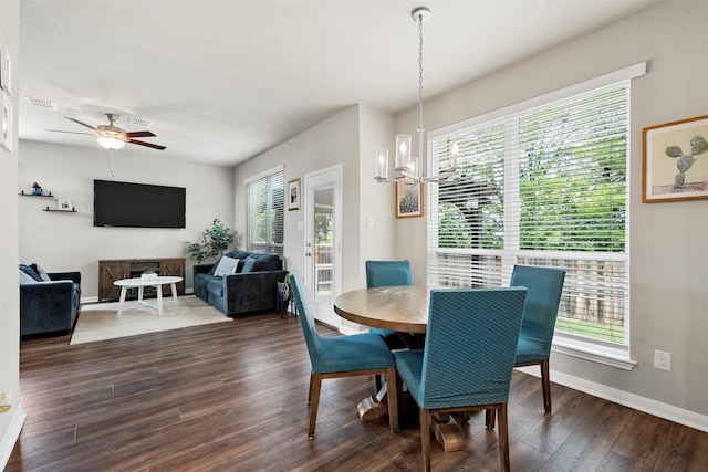 10517 Arabella Ln, Waco, TX 76708 - dining space with healthy amount of natural light, dark wood-type flooring, and baseboards