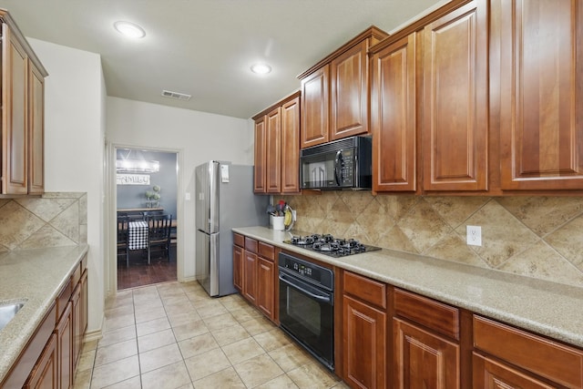 3425 Furlong Way, Fort Worth, TX 76244 - kitchen featuring black appliances, light tile patterned floors, backsplash, light countertops, and brown cabinetry