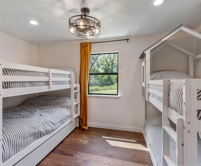 311 Oak Ln, Tool, TX 75143 - bedroom with baseboards, wood finished floors, heating unit, and recessed lighting