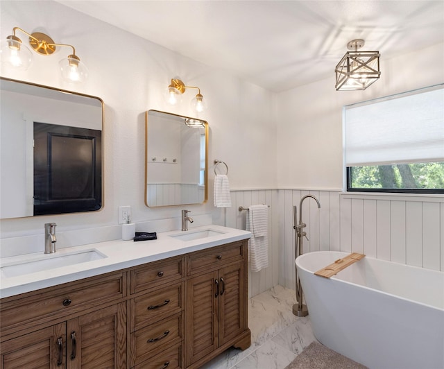 311 Oak Ln, Tool, TX 75143 - full bath featuring marble look tiles, wainscoting, a freestanding bath, and double vanity
