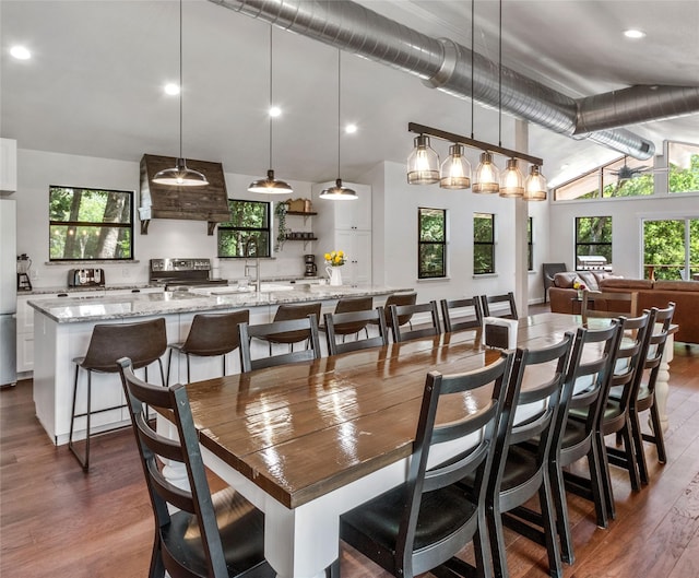311 Oak Ln, Tool, TX 75143 - dining space with lofted ceiling, dark wood finished floors, and recessed lighting