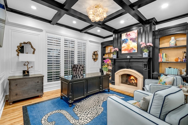 2600 Lakeview Ct, Prosper, TX 75078 - office with a decorative wall, crown molding, a warm lit fireplace, coffered ceiling, and light wood-type flooring