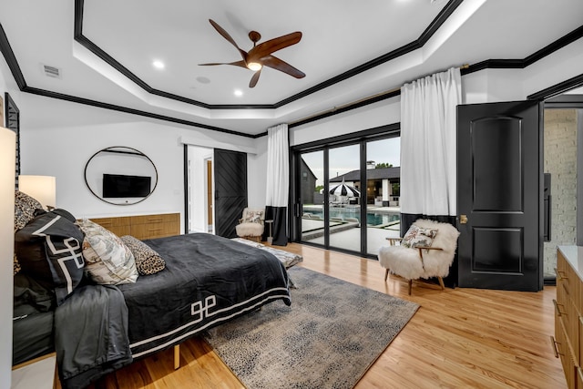 2600 Lakeview Ct, Prosper, TX 75078 - bedroom featuring ornamental molding, a tray ceiling, access to exterior, light wood-type flooring, and a ceiling fan
