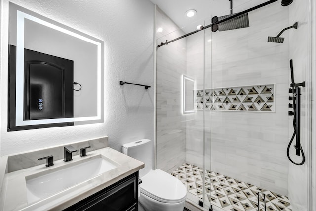2600 Lakeview Ct, Prosper, TX 75078 - full bath with a textured wall, toilet, a shower stall, and vanity