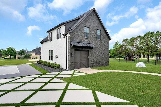 2600 Lakeview Ct, Prosper, TX 75078 - rear view of house with stone siding and an attached garage