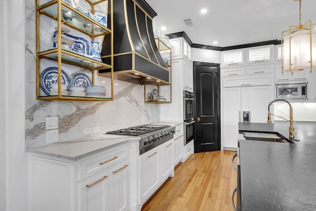 2600 Lakeview Ct, Prosper, TX 75078 - kitchen with stainless steel appliances, custom range hood, a sink, backsplash, and light wood-type flooring