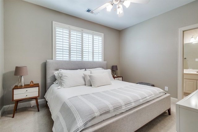 3704 Imperial Dr, Flower Mound, TX 75028 - bedroom with light colored carpet, ensuite bath, a ceiling fan, and baseboards
