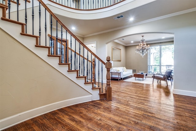 3704 Imperial Dr, Flower Mound, TX 75028 - staircase featuring arched walkways, wood finished floors, baseboards, a chandelier, and recessed lighting