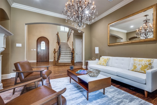 3704 Imperial Dr, Flower Mound, TX 75028 - living area featuring arched walkways, a chandelier, wood finished floors, crown molding, and stairs