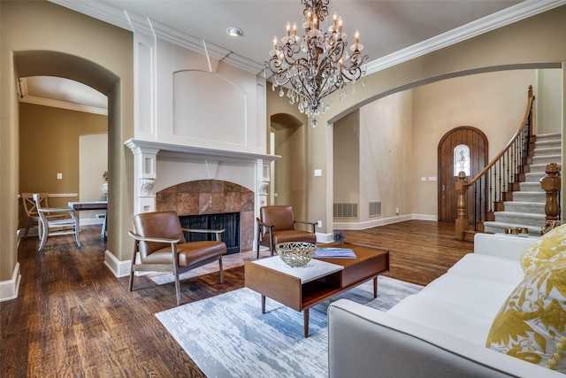 3704 Imperial Dr, Flower Mound, TX 75028 - living area with arched walkways, dark wood-style floors, baseboards, and ornamental molding