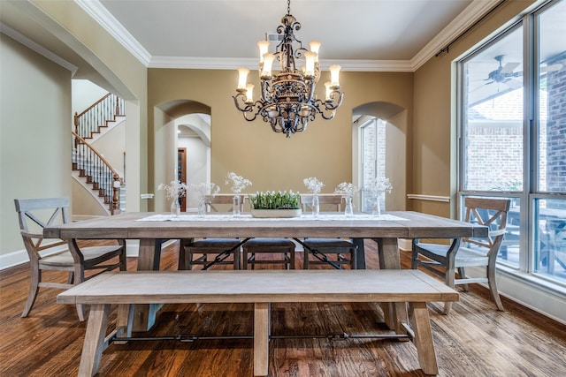 3704 Imperial Dr, Flower Mound, TX 75028 - dining space featuring arched walkways, a chandelier, ornamental molding, wood finished floors, and stairway