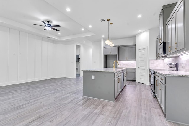 240 Rosemary Dr, Azle, TX 76020 - kitchen featuring gray cabinets, appliances with stainless steel finishes, backsplash, a sink, and recessed lighting