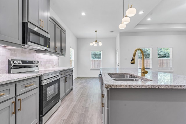 240 Rosemary Dr, Azle, TX 76020 - kitchen featuring stainless steel appliances, gray cabinets, a sink, decorative backsplash, and recessed lighting