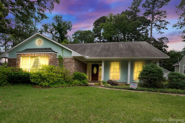 605 Erie St, Shreveport, LA 71106 - ranch-style house featuring a yard and brick siding