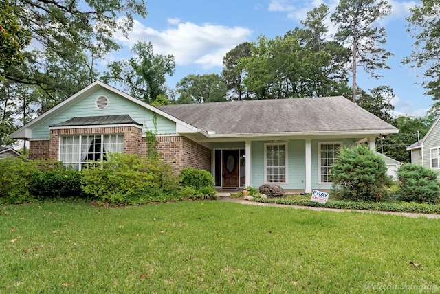 605 Erie St, Shreveport, LA 71106 - ranch-style home with a front lawn, brick siding, covered porch, and roof with shingles
