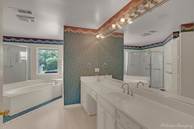 605 Erie St, Shreveport, LA 71106 - bathroom with a shower stall, a bath, wallpapered walls, double vanity, and baseboards