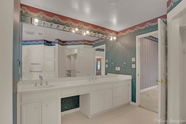 605 Erie St, Shreveport, LA 71106 - full bathroom featuring double vanity and wallpapered walls