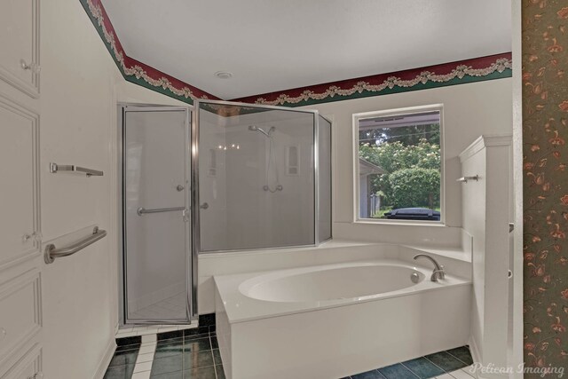 605 Erie St, Shreveport, LA 71106 - full bath featuring wallpapered walls, tile patterned flooring, a bath, and a shower stall