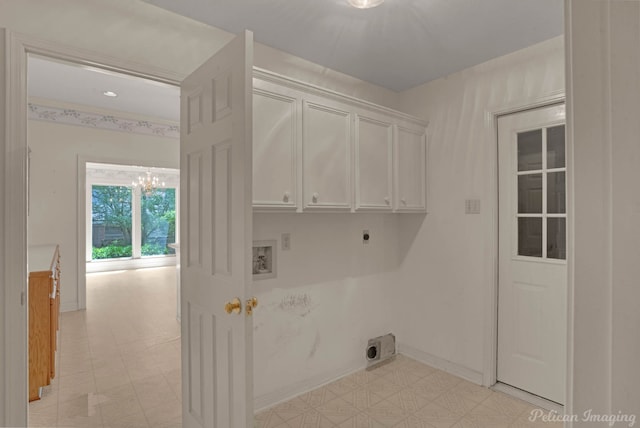 605 Erie St, Shreveport, LA 71106 - laundry room with electric dryer hookup, hookup for a washing machine, a chandelier, and cabinet space