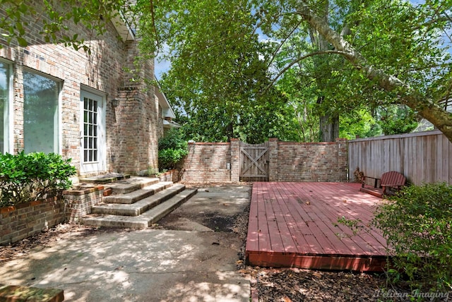 605 Erie St, Shreveport, LA 71106 - fenced backyard featuring a gate and a wooden deck