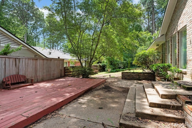 605 Erie St, Shreveport, LA 71106 - fenced backyard with a deck and a patio
