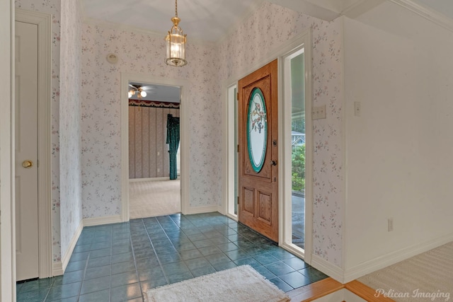 605 Erie St, Shreveport, LA 71106 - foyer entrance with wallpapered walls, baseboards, and tile patterned floors