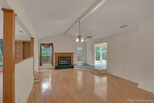 605 Erie St, Shreveport, LA 71106 - unfurnished living room featuring light wood-style flooring, ceiling fan, baseboards, a premium fireplace, and crown molding