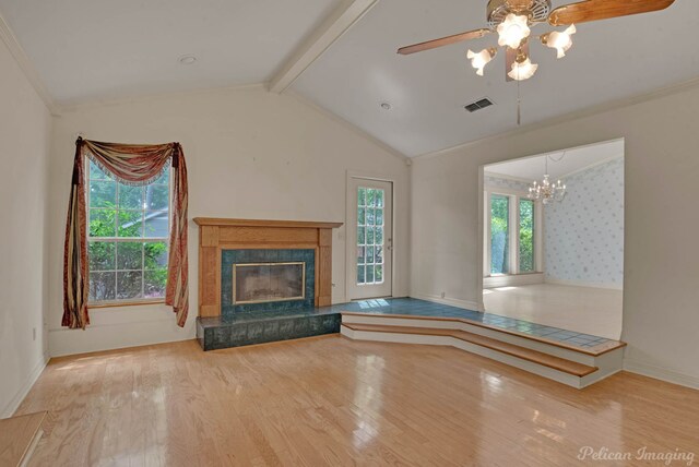 605 Erie St, Shreveport, LA 71106 - unfurnished living room featuring wood finished floors, a ceiling fan, a premium fireplace, a chandelier, and ornamental molding