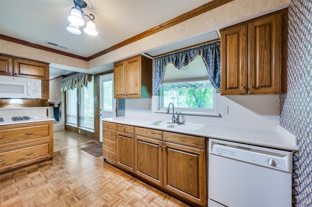 1122 Gloucester Ct N, Irving, TX 75062 - kitchen featuring white appliances, a sink, wallpapered walls, brown cabinetry, and light countertops
