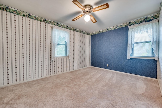 1122 Gloucester Ct N, Irving, TX 75062 - unfurnished room with carpet floors, healthy amount of natural light, wallpapered walls, and a ceiling fan