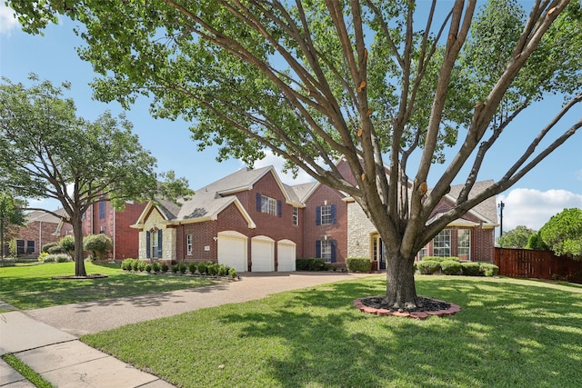1908 Longfellow Ln, Flower Mound, TX 75028 - traditional-style home featuring an attached garage, brick siding, and driveway