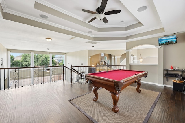 1908 Longfellow Ln, Flower Mound, TX 75028 - game room featuring a ceiling fan, arched walkways, a tray ceiling, ornamental molding, and wood finished floors
