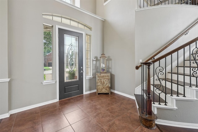 1908 Longfellow Ln, Flower Mound, TX 75028 - tiled foyer entrance featuring plenty of natural light, baseboards, and stairway