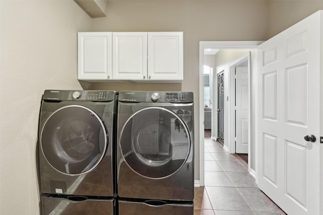 1908 Longfellow Ln, Flower Mound, TX 75028 - laundry room with separate washer and dryer, cabinet space, and light tile patterned flooring