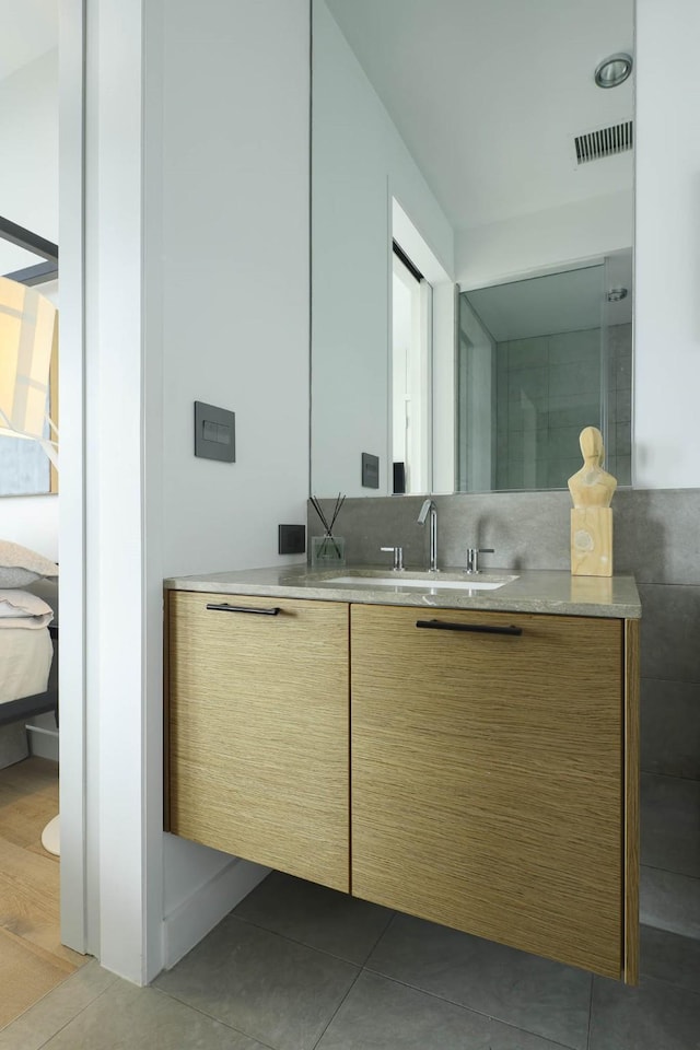 2900 Mckinnon St Unit 604, Dallas, TX 75201 - ensuite bathroom with vanity and tile patterned floors