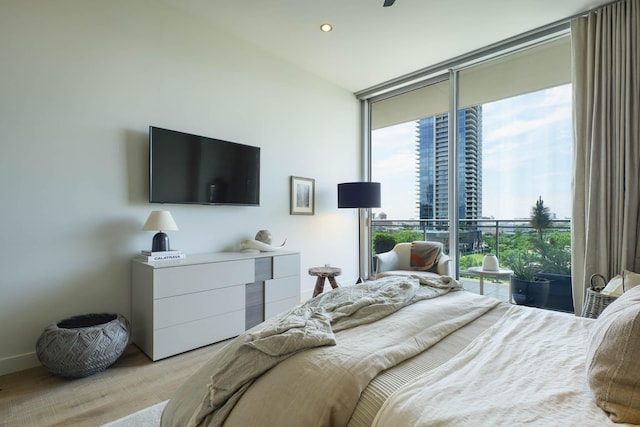 2900 Mckinnon St Unit 604, Dallas, TX 75201 - bedroom with floor to ceiling windows, recessed lighting, and access to exterior