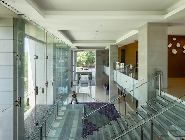 2900 Mckinnon St Unit 604, Dallas, TX 75201 - hallway with a tray ceiling and tile patterned flooring
