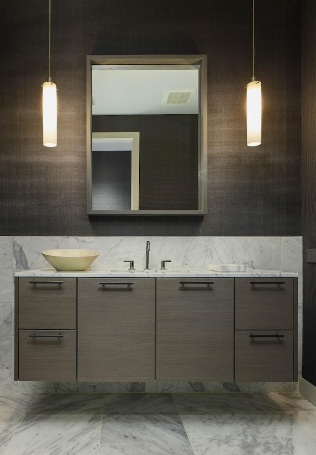 2900 Mckinnon St Unit 604, Dallas, TX 75201 - bathroom featuring double vanity and marble finish flooring