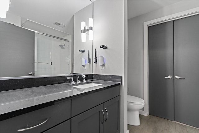 5609 Smu Blvd Unit 205, Dallas, TX 75206 - full bath featuring toilet, vanity, and an enclosed shower