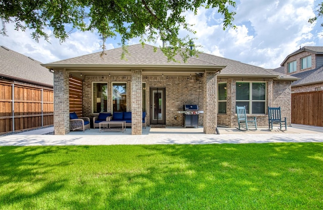 10140 Kingsland Trl, Mckinney, TX 75072 - back of house with an outdoor hangout area, brick siding, and a patio