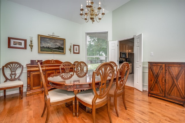 2925 Custer Dr, Corinth, TX 76210 - dining space featuring a chandelier, light wood-type flooring, and high vaulted ceiling